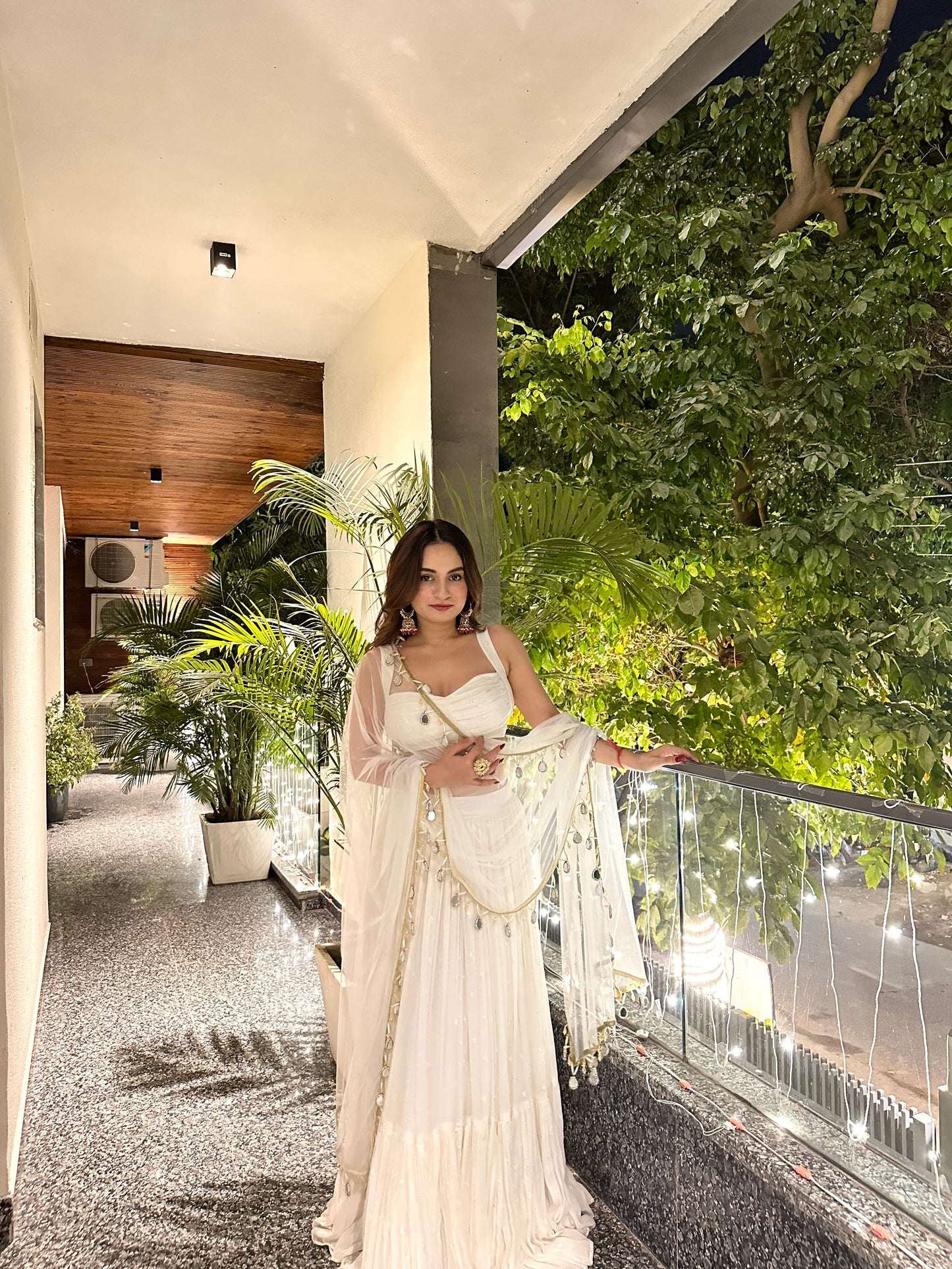 Elegant white Hans Lehnga by Imagine By Shiwali with intricate embroidery and flowing fabric, perfect for traditional celebrations.