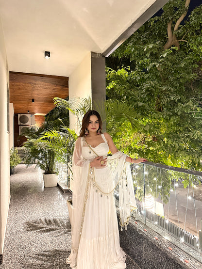 Elegant white Hans Lehnga by Imagine By Shiwali with intricate embroidery and flowing fabric, perfect for traditional celebrations.