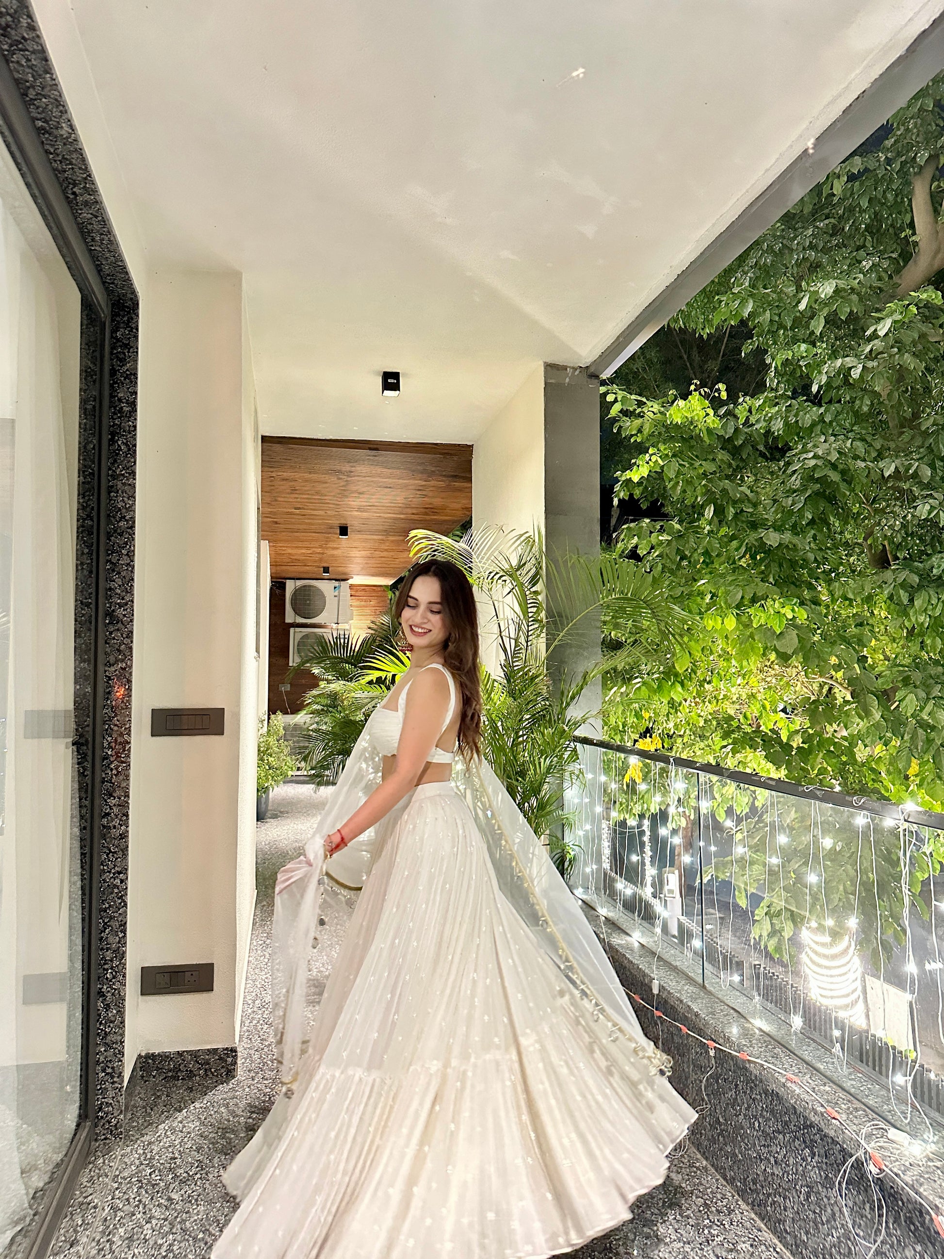 Elegant white Lehnga by Imagine By Shiwali featuring intricate embroidery and traditional design, perfect for festive occasions.