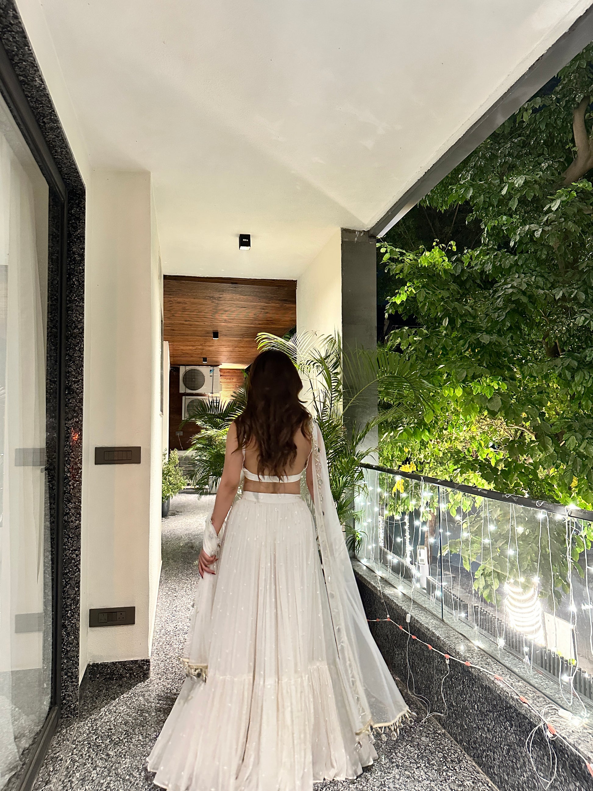 Elegant white Hans Lehnga by Imagine By Shiwali featuring intricate embroidery and traditional design for festive occasions.