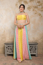 Kalki multicolour sharara set by Imagine By Shiwali, featuring vibrant traditional attire with intricate patterns and flowing fabric.