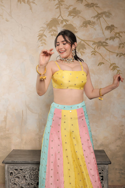 Multicolour Kalki sharara set by Imagine By Shiwali, featuring vibrant traditional embroidery and flowing fabric.