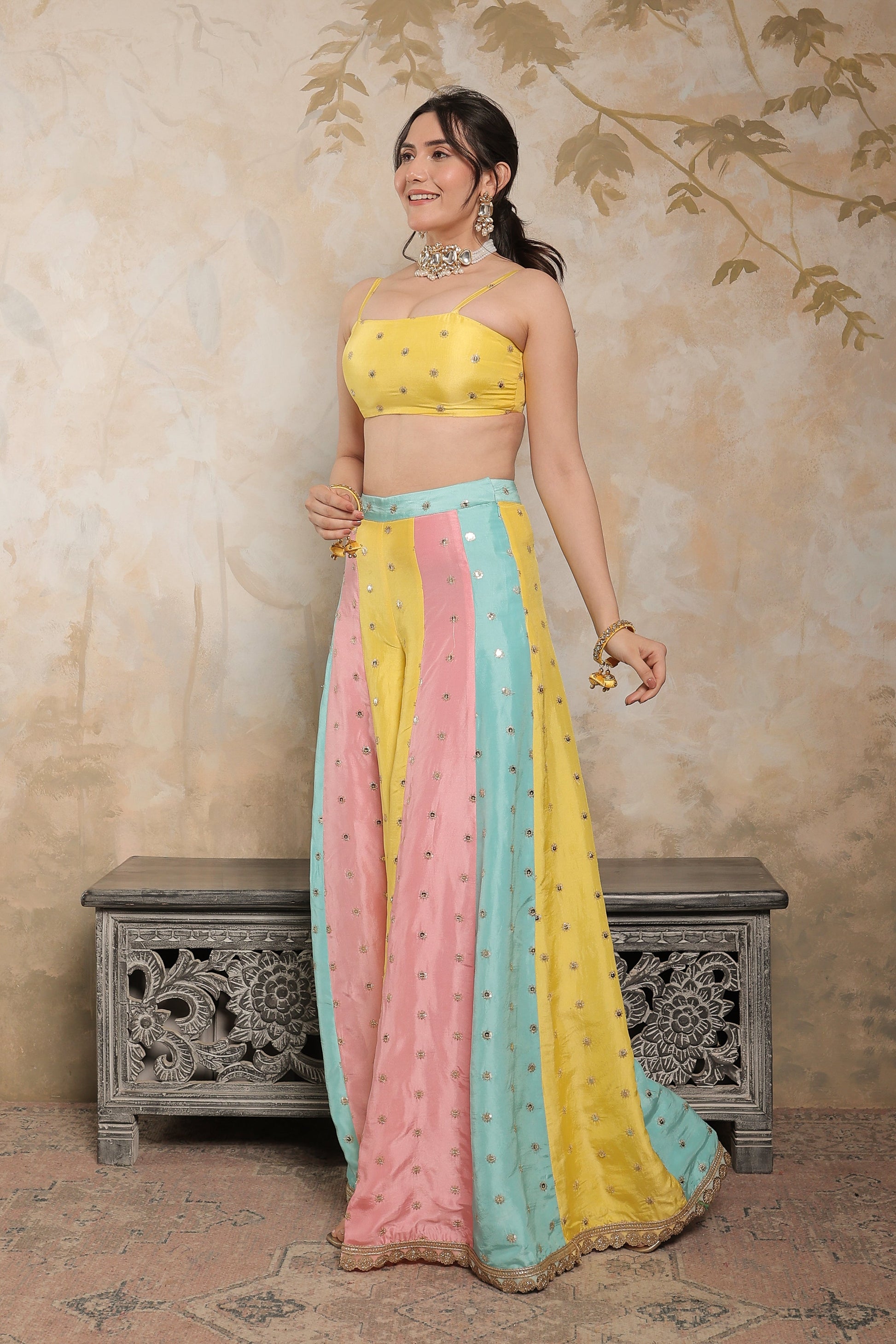 Kalki multicolour sharara set by Imagine By Shiwali featuring vibrant traditional Indian attire with embroidered details.