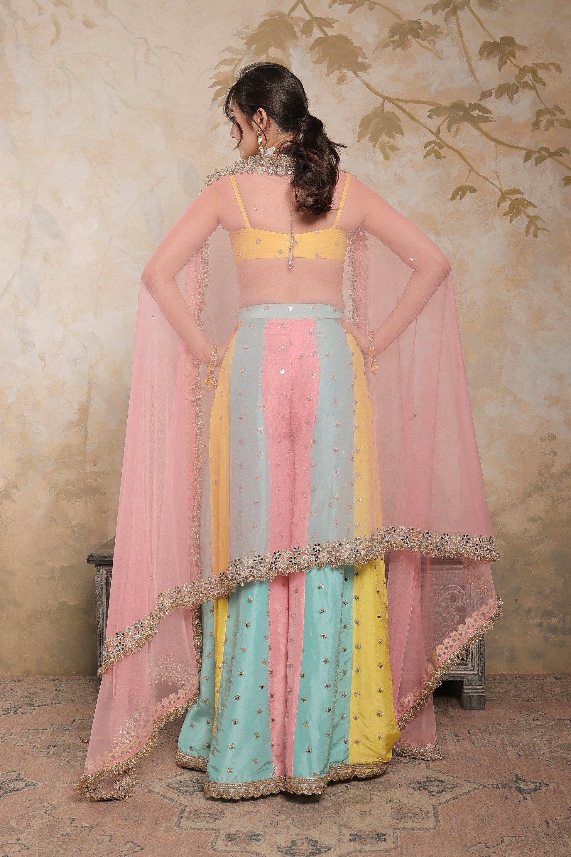 Kalki multicolour sharara set by Imagine By Shiwali featuring vibrant traditional Indian attire with intricate detailing.