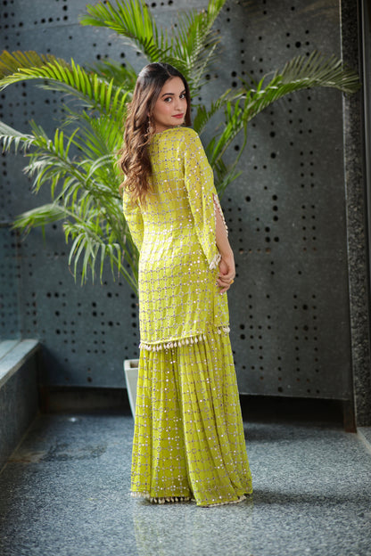Kangana parrot green kurti and sharara set by Imagine By Shiwali, featuring intricate embroidery and traditional design.