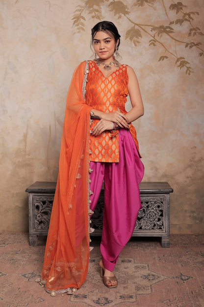 Orange and purple Kavya dhoti set by Imagine By Shiwali, featuring traditional fabric and intricate design details.