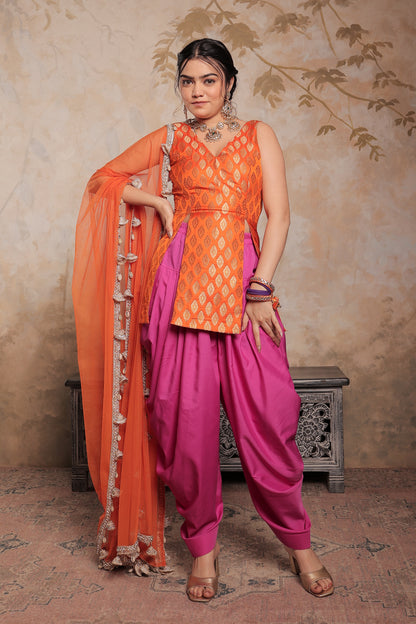 Orange and purple Kavya dhoti set by Imagine By Shiwali, featuring traditional Indian attire with intricate design.