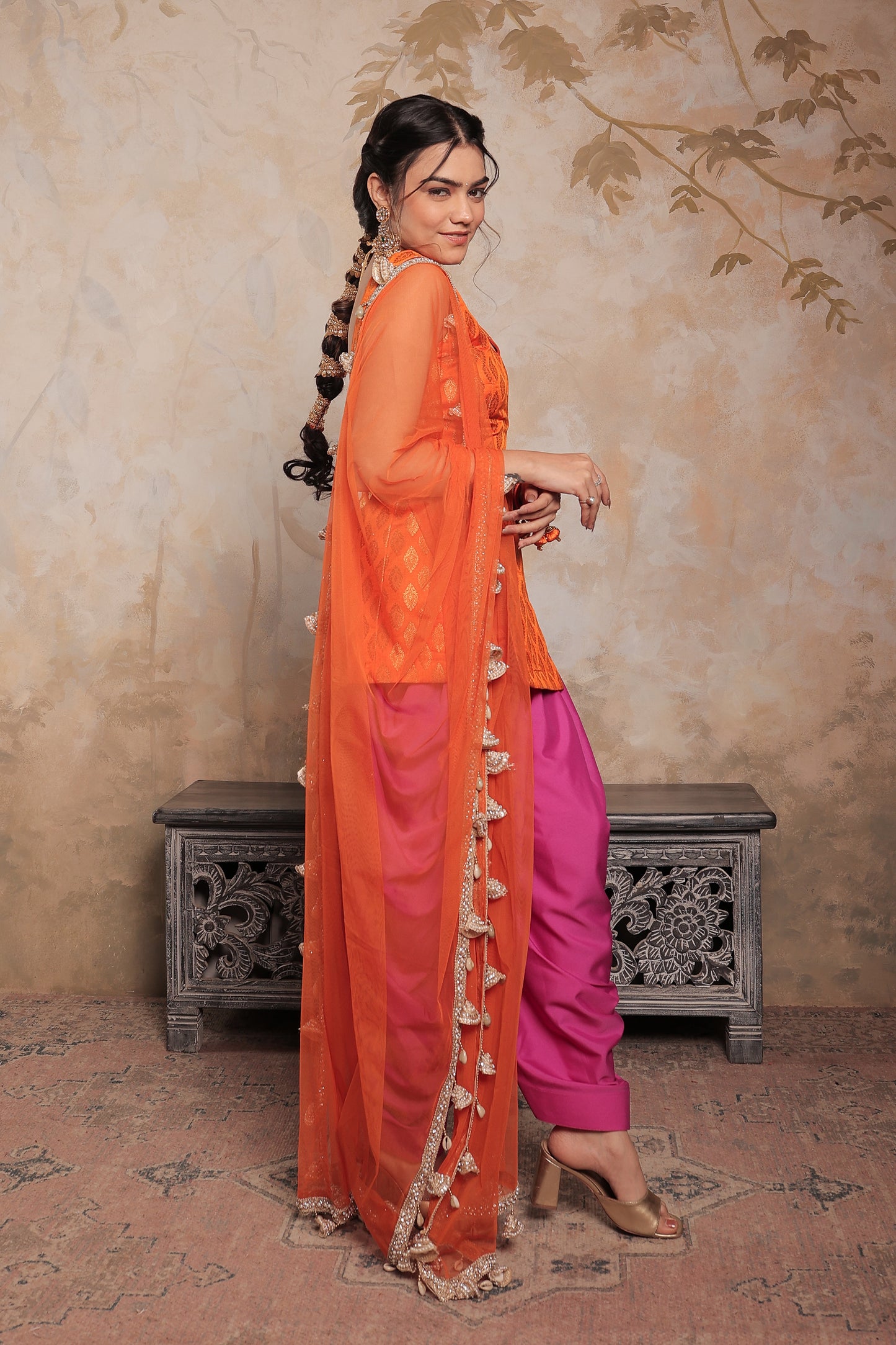 Orange and purple Kavya dhoti set by Imagine By Shiwali, featuring traditional fabric and intricate design details.