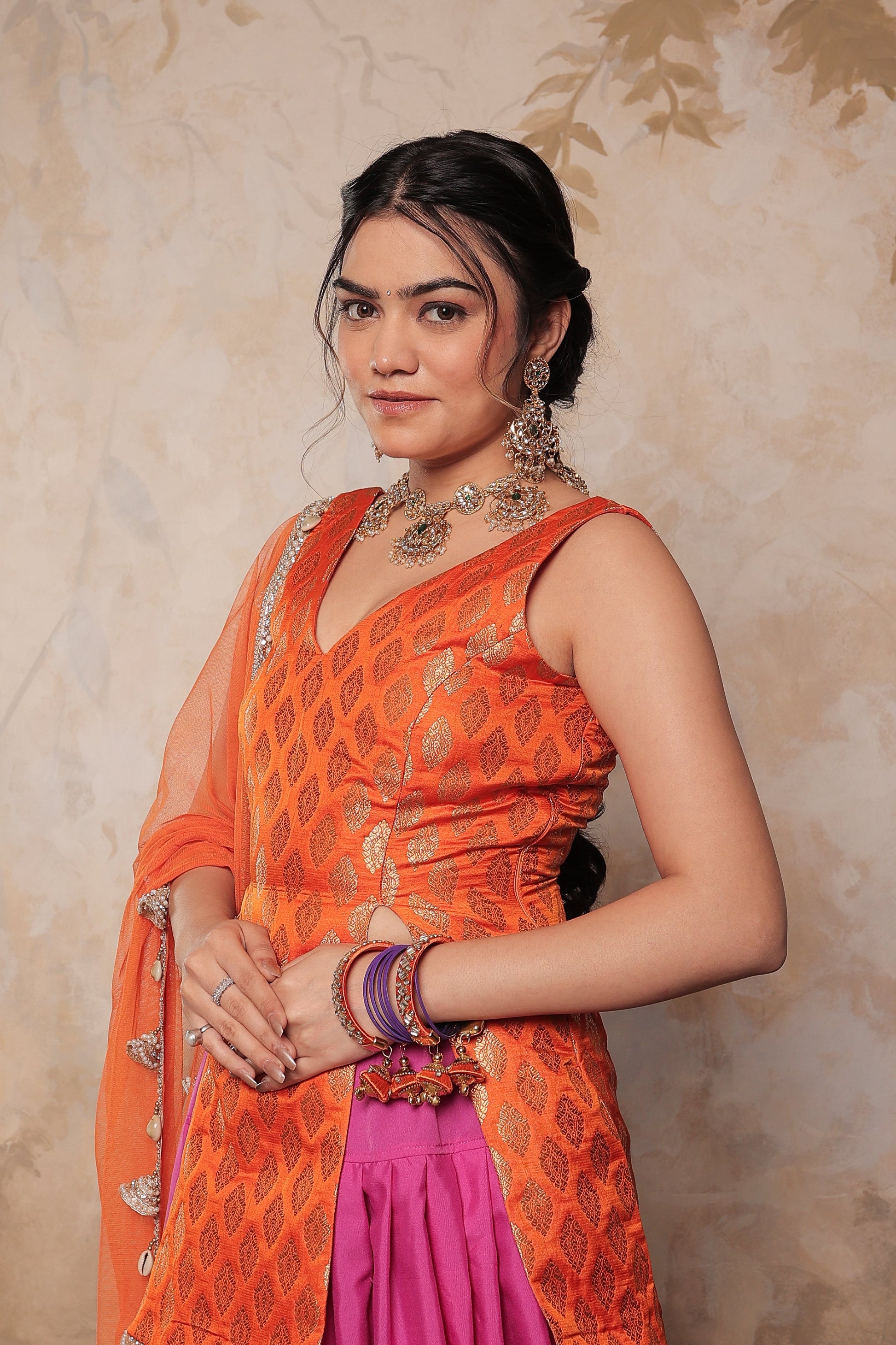 Orange and purple Kavya dhoti set by Imagine By Shiwali, featuring traditional fabric and intricate design details.