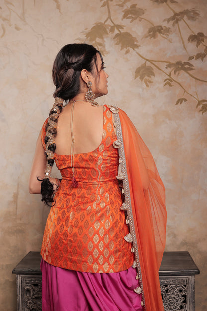Orange and purple Kavya dhoti set by Imagine By Shiwali, featuring traditional fabric and intricate design details.
