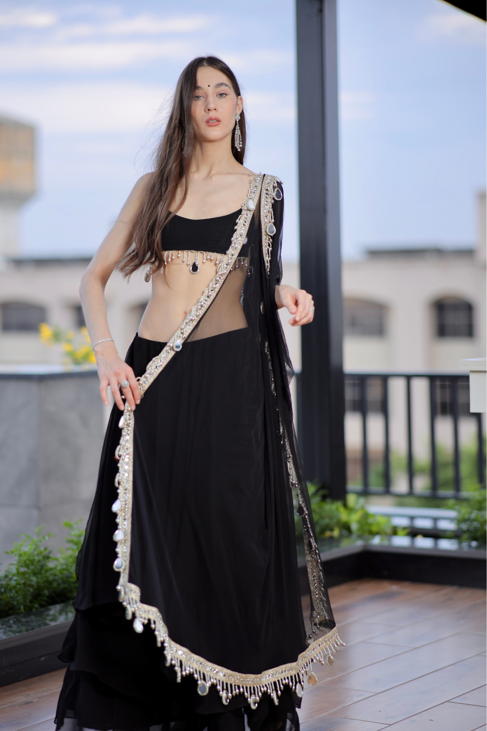 Black Kiara Lehnga by Imagine By Shiwali featuring intricate embroidery and traditional design, displayed on a mannequin.