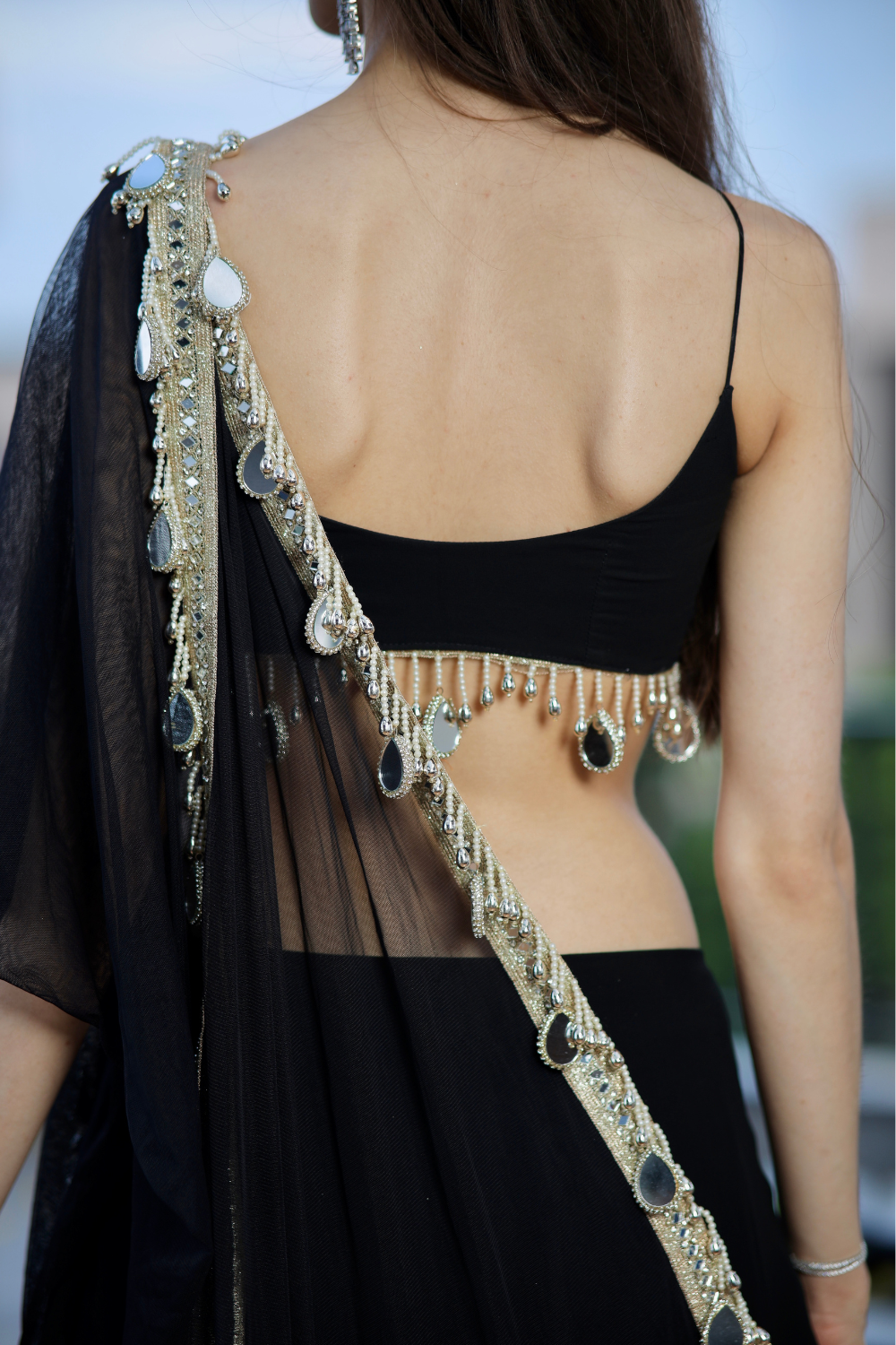 Black Kiara Lehnga by Imagine By Shiwali featuring intricate embroidery and traditional design, displayed on a mannequin.