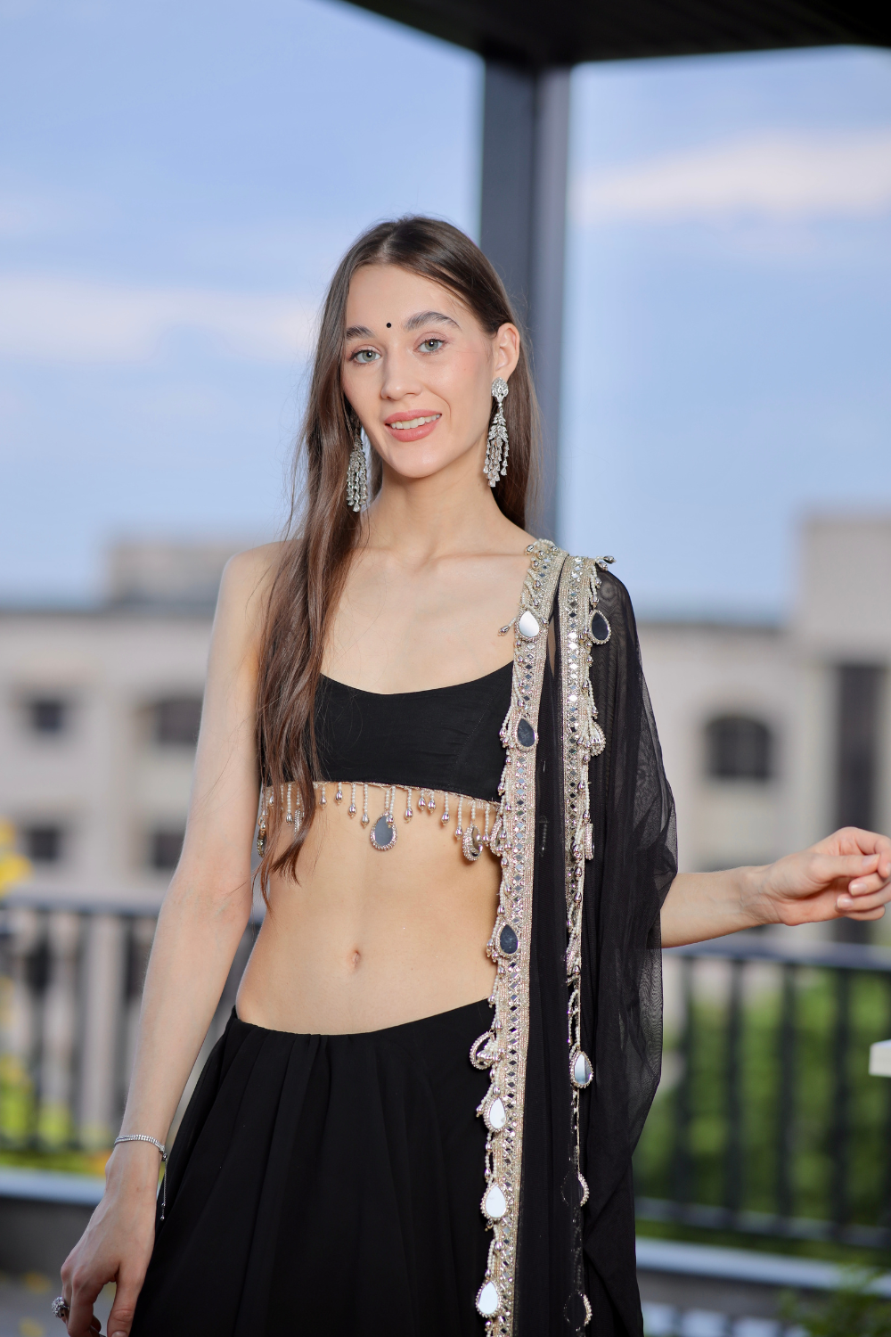 Black Kiara Lehnga by Imagine By Shiwali featuring intricate embroidery and traditional design on flowing fabric.