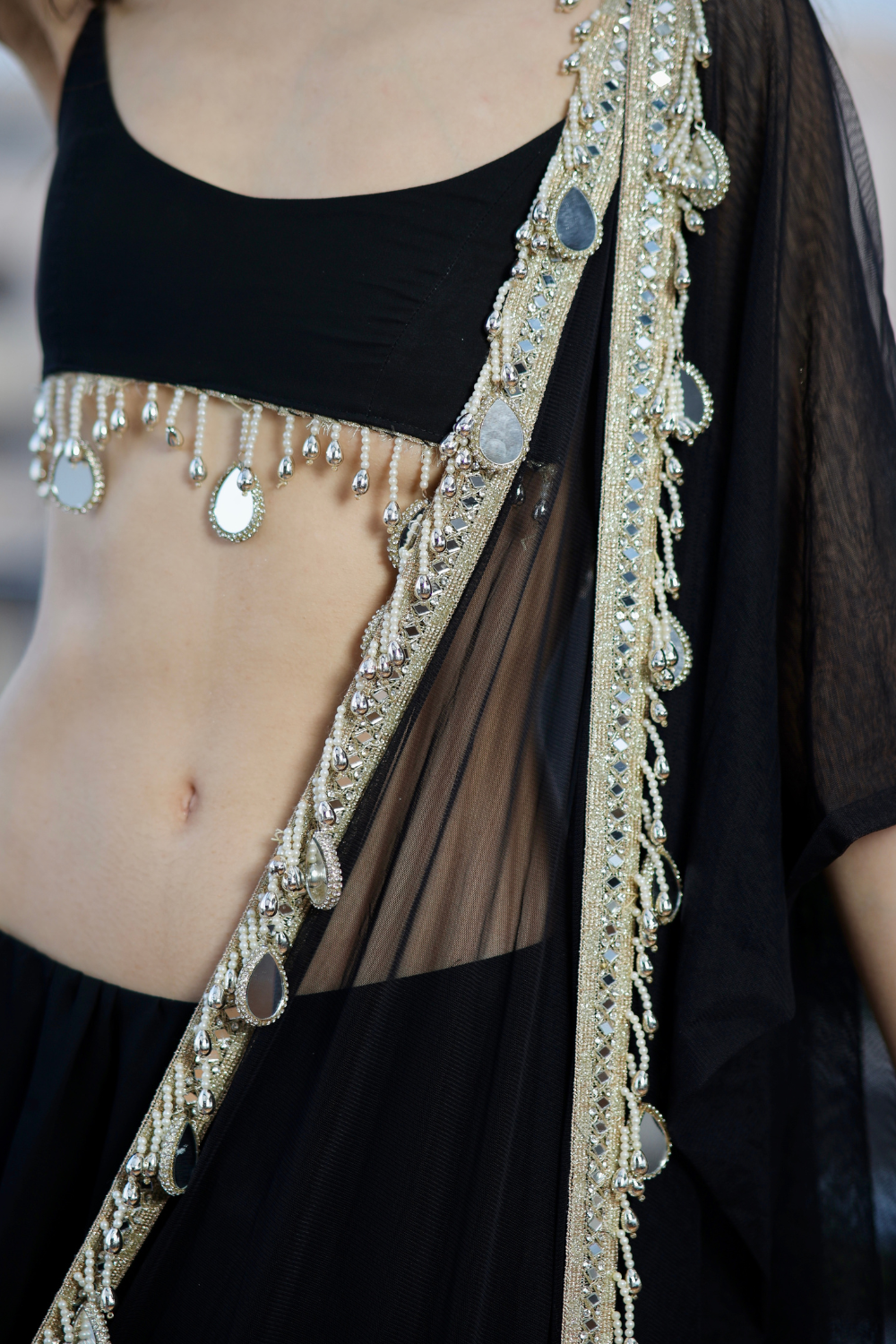 Elegant black Lehnga from Imagine By Shiwali featuring intricate embroidery and flowing fabric for traditional occasions.