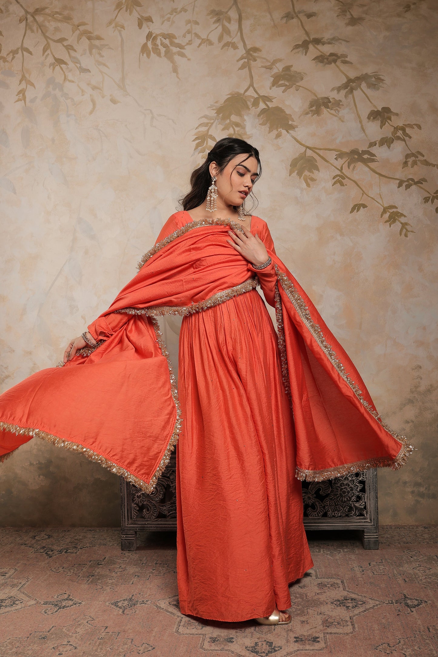 Laila orange chanderi anarkali dress by Imagine By Shiwali, featuring intricate fabric and traditional embroidery.