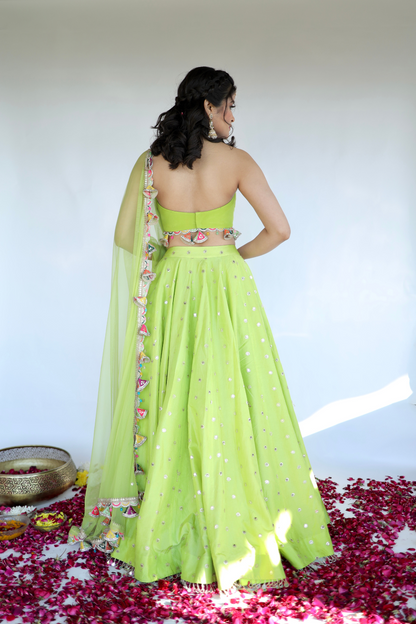 Lotus green lehnga from Imagine By Shiwali featuring intricate embroidery and traditional design for festive occasions.