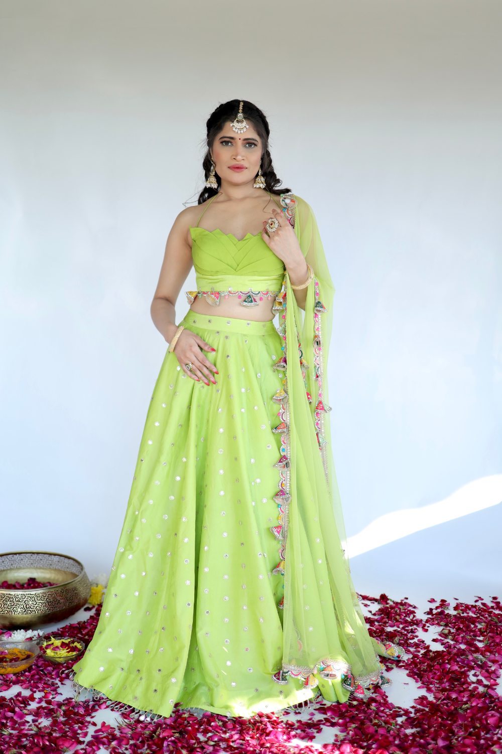 Lotus green Lehnga dress by Imagine By Shiwali featuring intricate embroidery and flowing fabric.