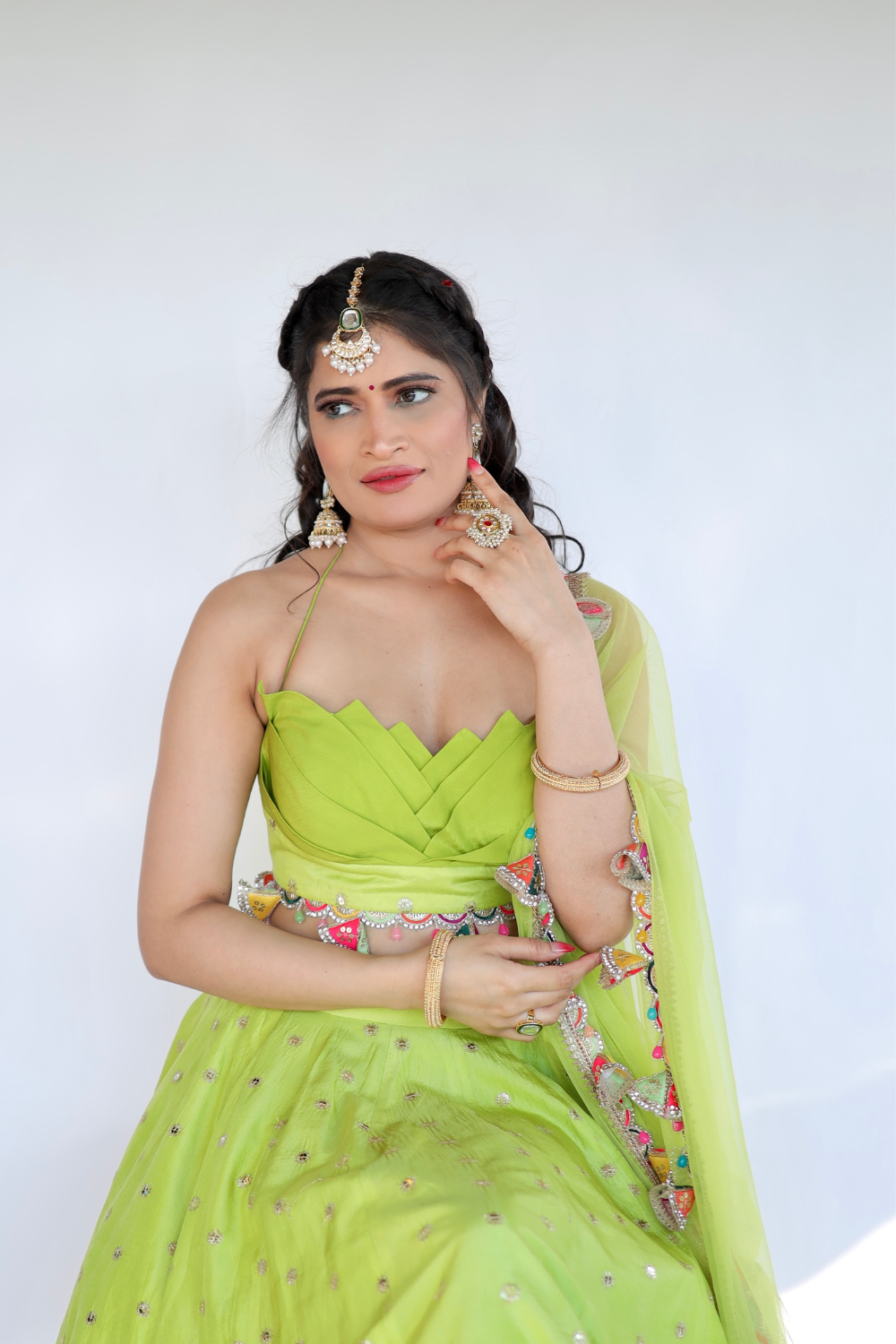 Lotus green lehnga by Imagine By Shiwali featuring intricate embroidery and flowing fabric, traditional Indian ethnic wear.