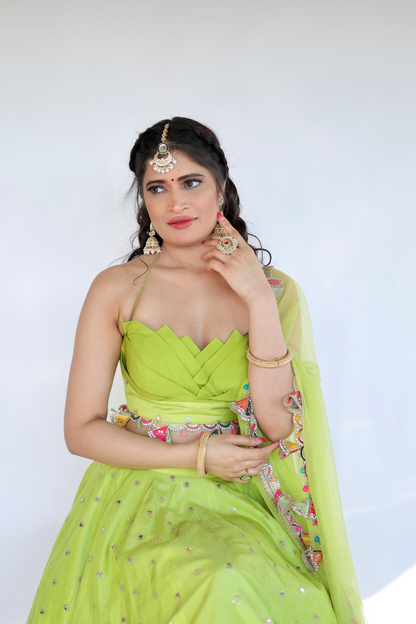Lotus green lehnga by Imagine By Shiwali featuring intricate embroidery and flowing fabric, traditional Indian ethnic wear.