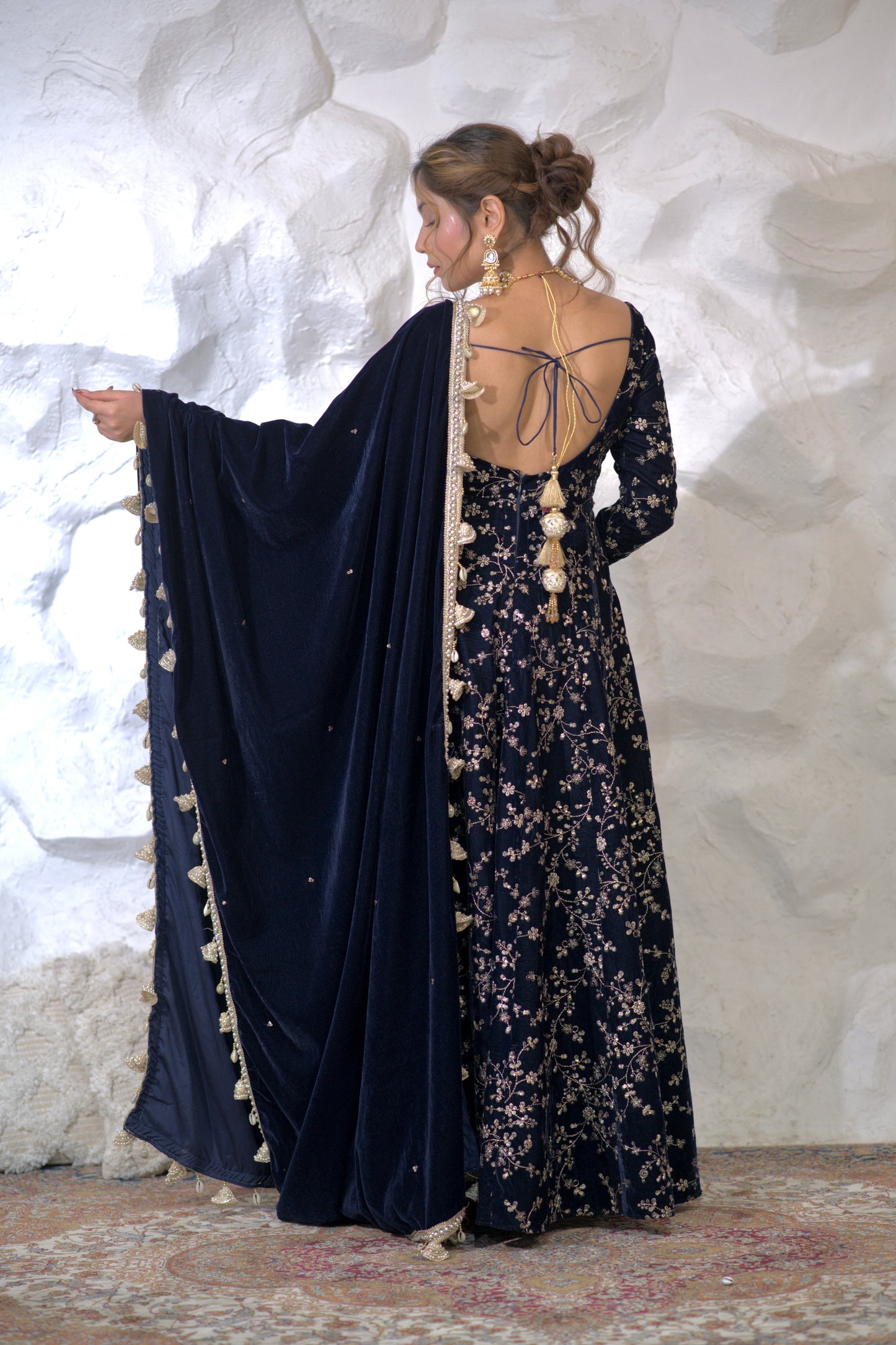 Navy blue Malaika Velvet Anarkali dress by Imagine By Shiwali, featuring intricate embroidery and flowing fabric.