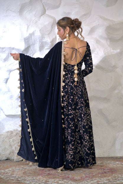 Navy blue Malaika Velvet Anarkali dress by Imagine By Shiwali, featuring intricate embroidery and flowing fabric.