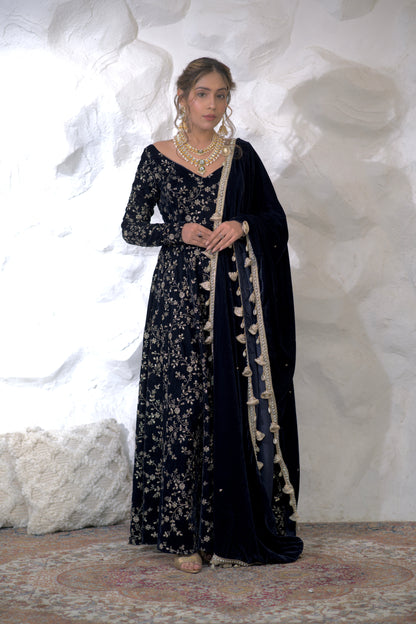 Navy blue velvet Anarkali dress by Imagine By Shiwali, featuring intricate embroidery and a flowing silhouette.