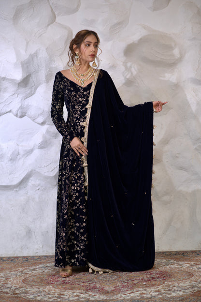 Navy blue Malaika Velvet Anarkali dress by Imagine By Shiwali, featuring intricate embroidery and flowing fabric.