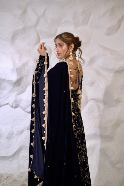 Navy blue velvet Anarkali dress with intricate embroidery by Imagine By Shiwali, featuring a flowing silhouette and elegant design.