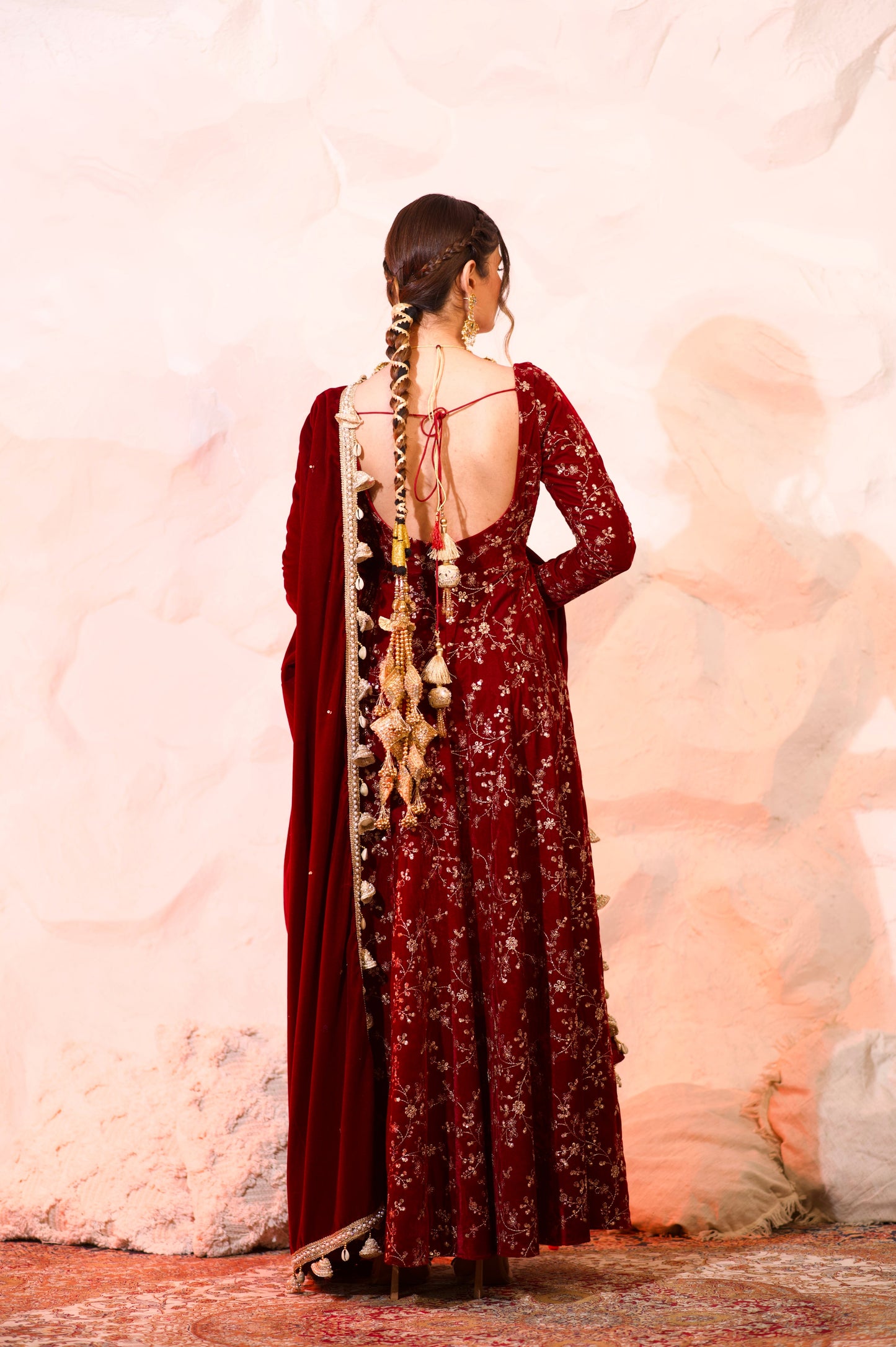 Red velvet Malaika Anarkali dress by Imagine By Shiwali, featuring intricate embroidery and a flowing silhouette.