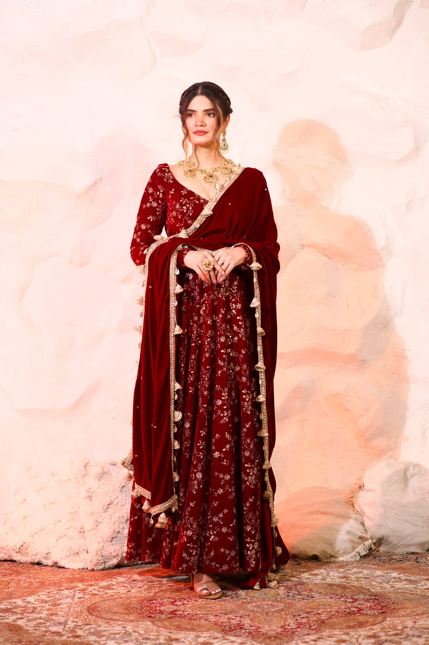 Red velvet Malaika Anarkali dress by Imagine by Shiwali, featuring intricate embroidery and a flowy silhouette.
