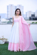 White and pink Meera Anarkali dress by Imagine By Shiwali, featuring elegant traditional embroidery and flowing fabric.