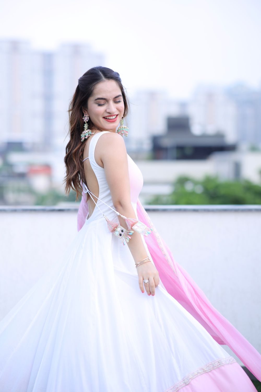 White and pink Meera Anarkali dress by Imagine By Shiwali, featuring intricate embroidery and traditional Indian design.