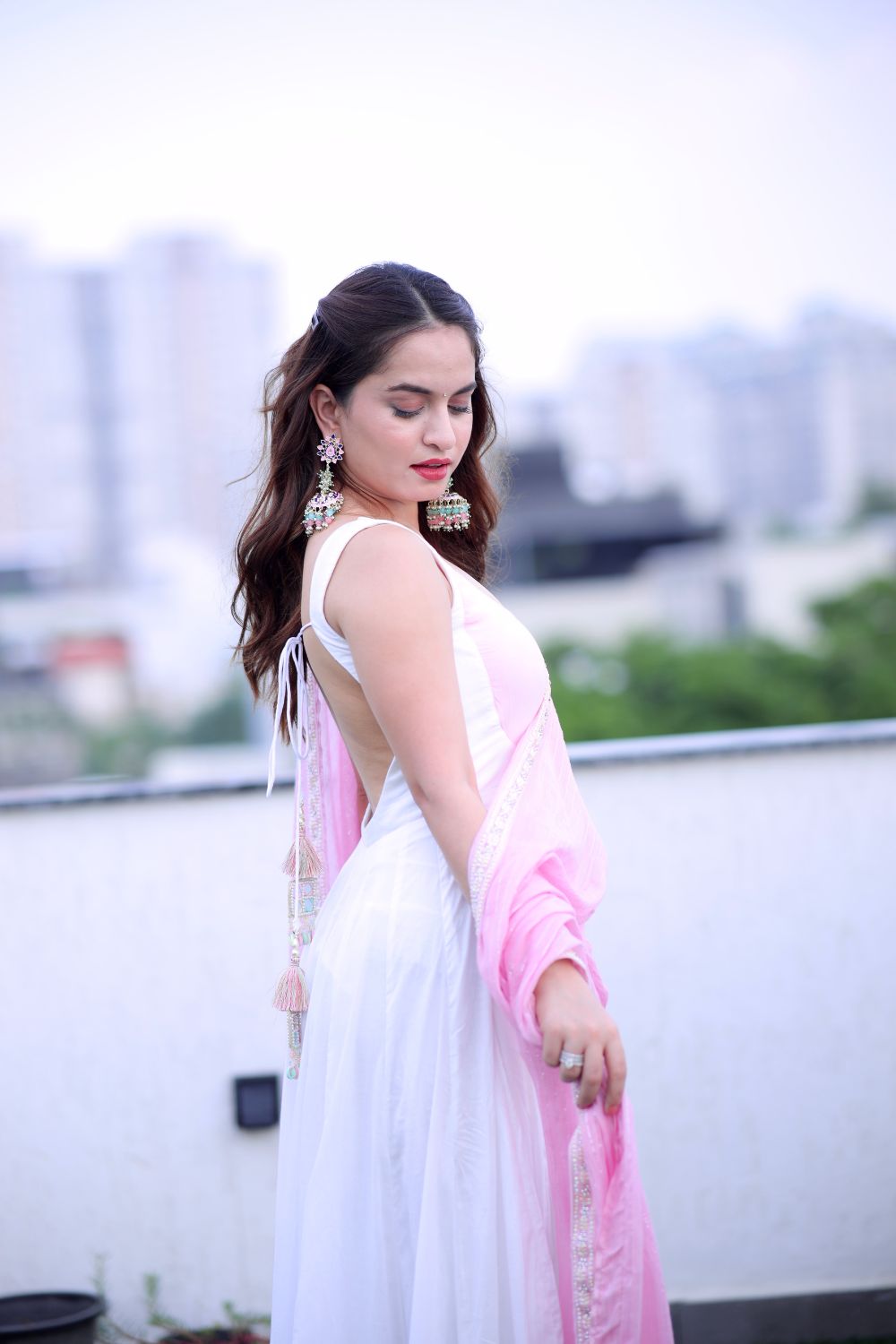 White and pink Meera Anarkali dress by Imagine By Shiwali, featuring intricate embroidery and flowy fabric.