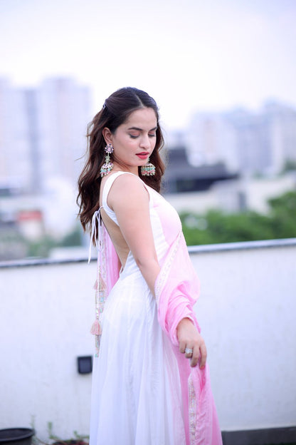 White and pink Meera Anarkali dress by Imagine By Shiwali, featuring intricate embroidery and flowy fabric.