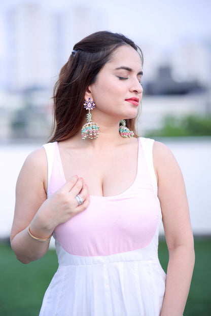White and pink Meera Anarkali dress by Imagine By Shiwali, featuring intricate embroidery and flowing fabric.