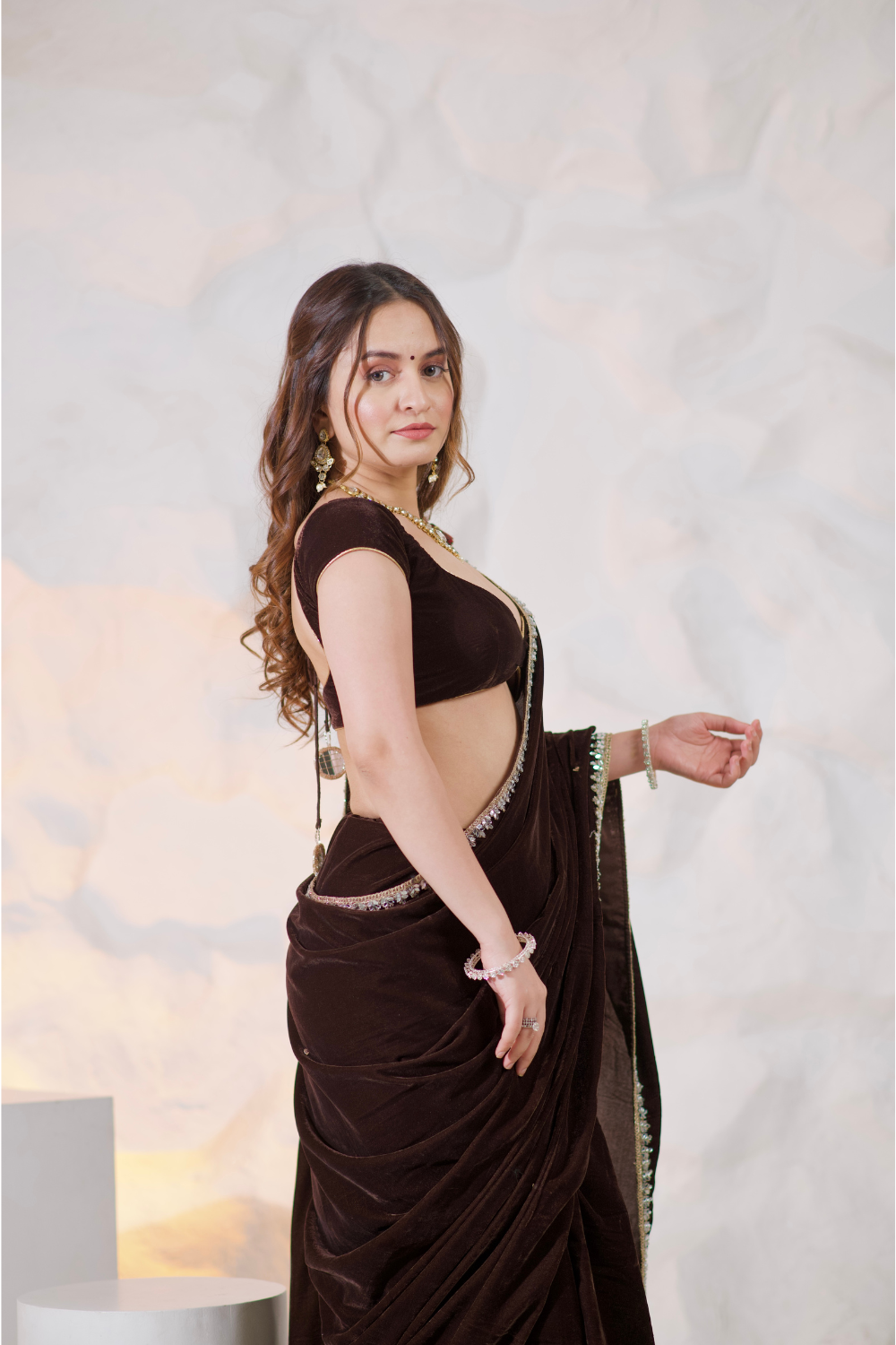 Nazia Brown Velvet Saree by Imagine By Shiwali, showcasing rich brown velvet fabric with elegant drape and intricate detailing.