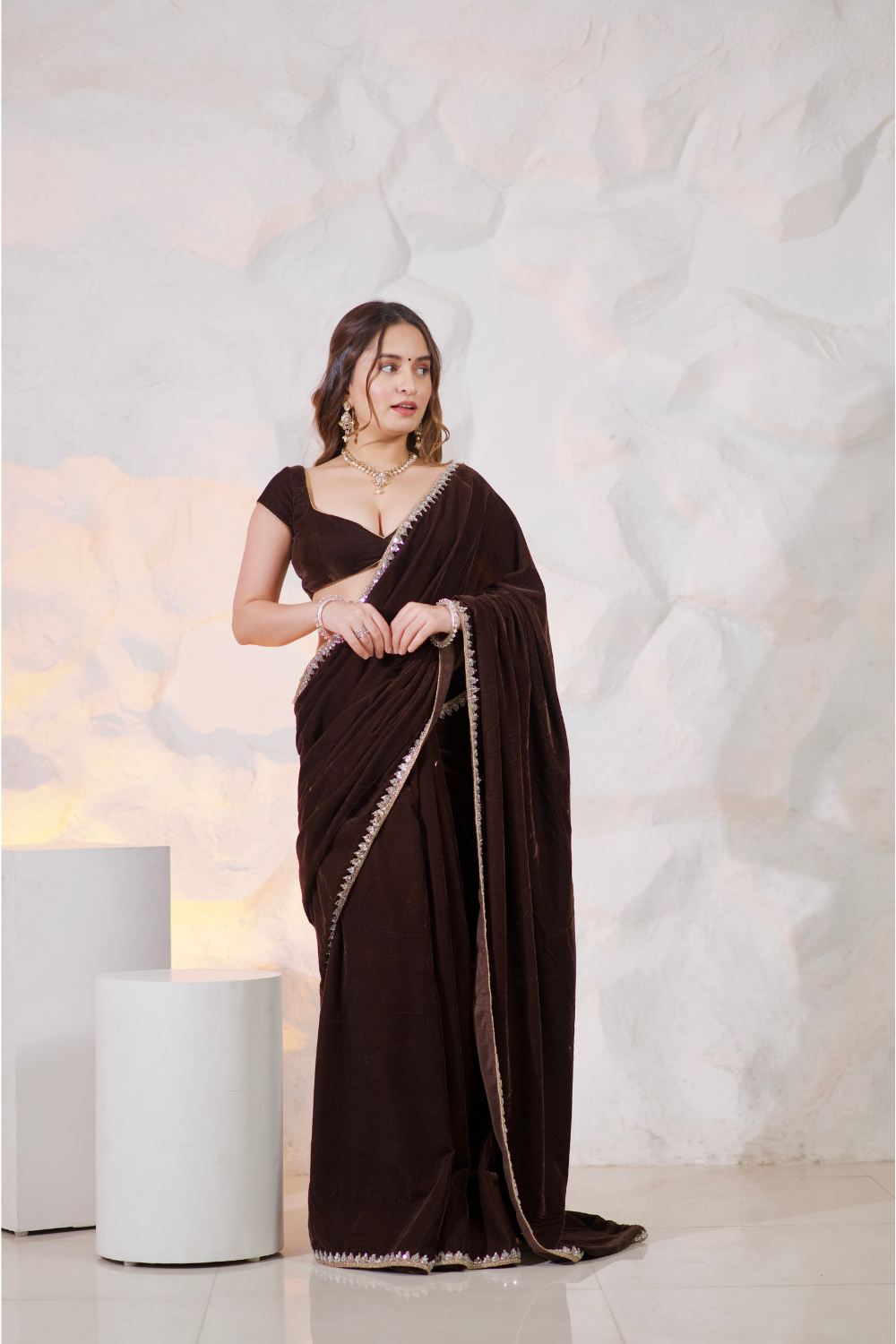 Brown velvet saree by Imagine By Shiwali, showcasing elegant draping and rich fabric detail.