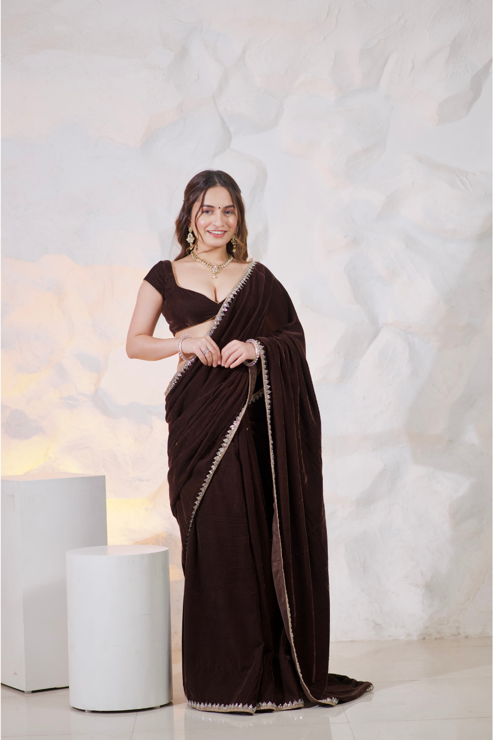 Brown velvet saree by Imagine By Shiwali featuring elegant drape and intricate detailing.