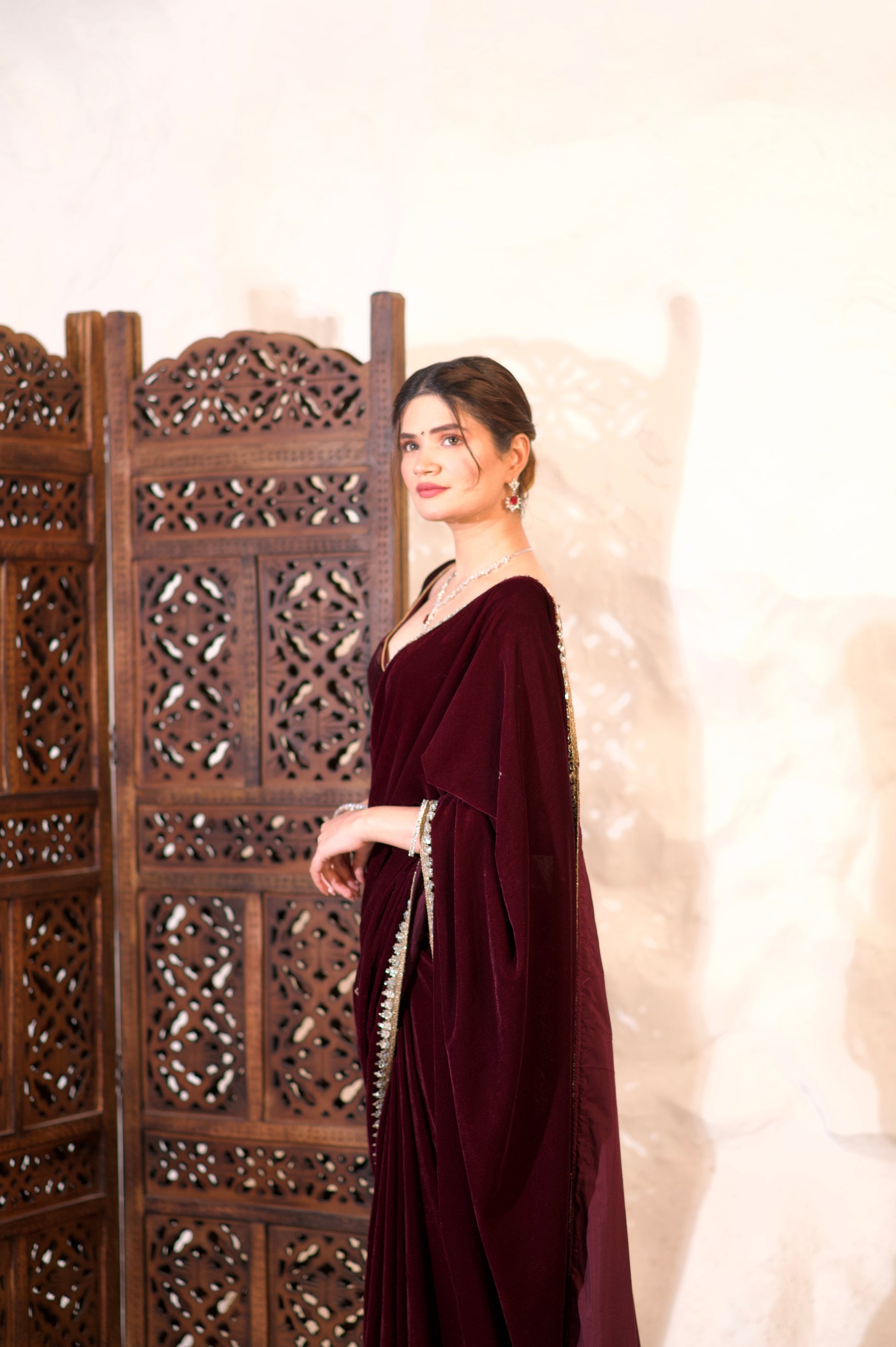 Nazia Wine Velvet Saree by Imagine By Shiwali, elegant deep wine red velvet fabric draped in a traditional style.