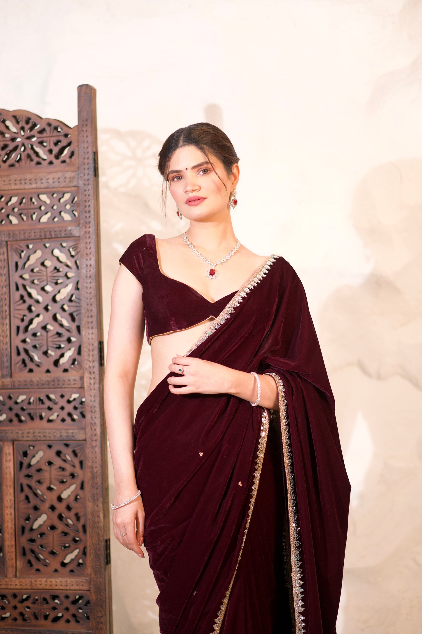 Nazia Wine Velvet Saree by Imagine By Shiwali, showcasing rich wine-colored velvet fabric and elegant drape.