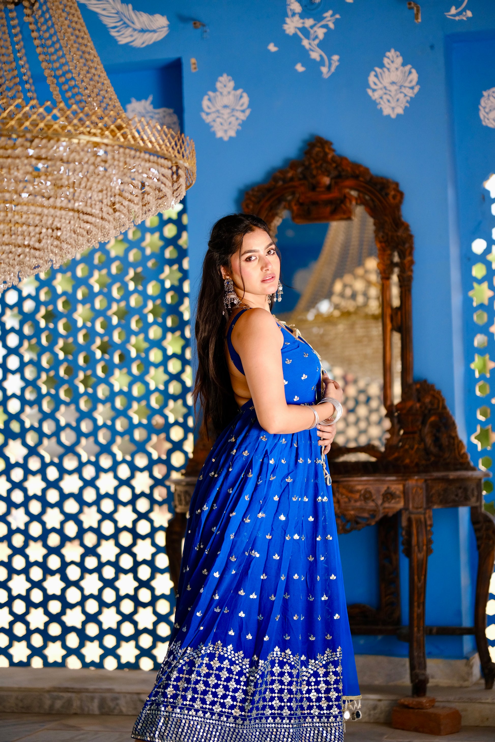 Radha Blue Anarkali dress by Imagine By Shiwali, featuring intricate embroidery and flowing fabric in shades of blue.