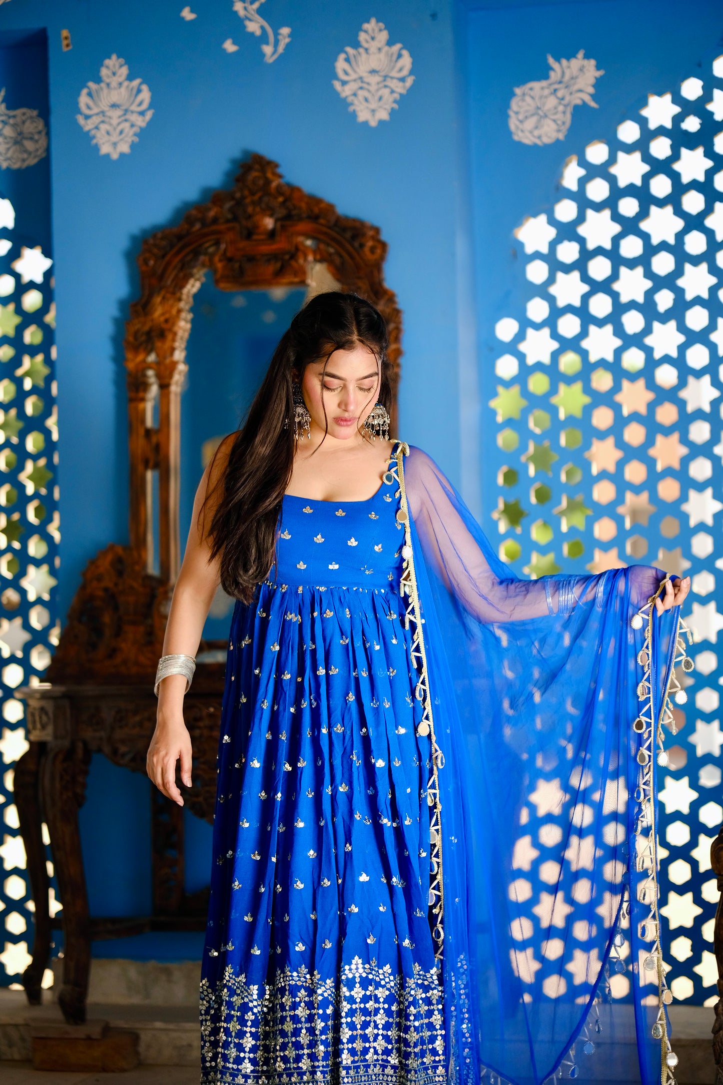 Radha Blue Anarkali dress by Imagine By Shiwali featuring intricate embroidery and flowing fabric.