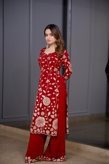 Red straight suit from Radha collection by Imagine By Shiwali, featuring traditional ethnic design and vibrant fabric details.