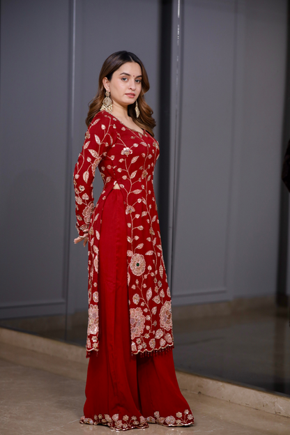 Red straight suit from Radha collection by Imagine By Shiwali, featuring a vibrant red fabric with traditional design details.