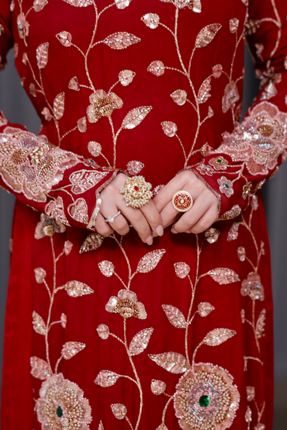Red straight suit from Radha collection by Imagine By Shiwali, featuring traditional design and elegant fabric.
