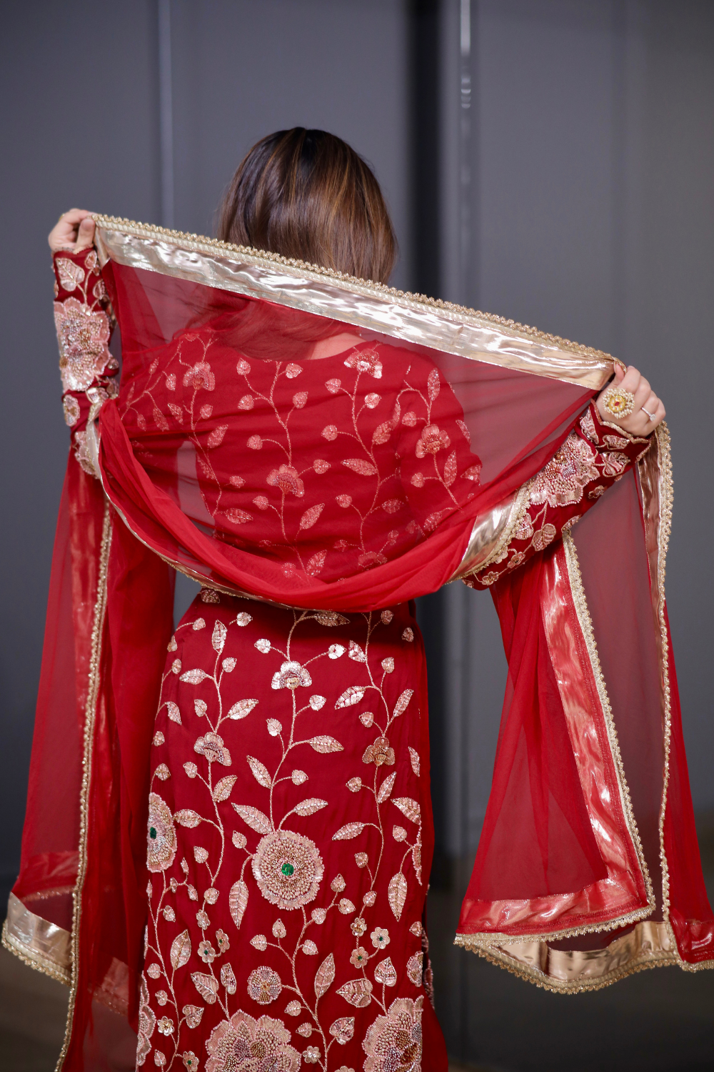 Red straight suit from Radha collection by Imagine By Shiwali, featuring traditional design and vibrant fabric.
