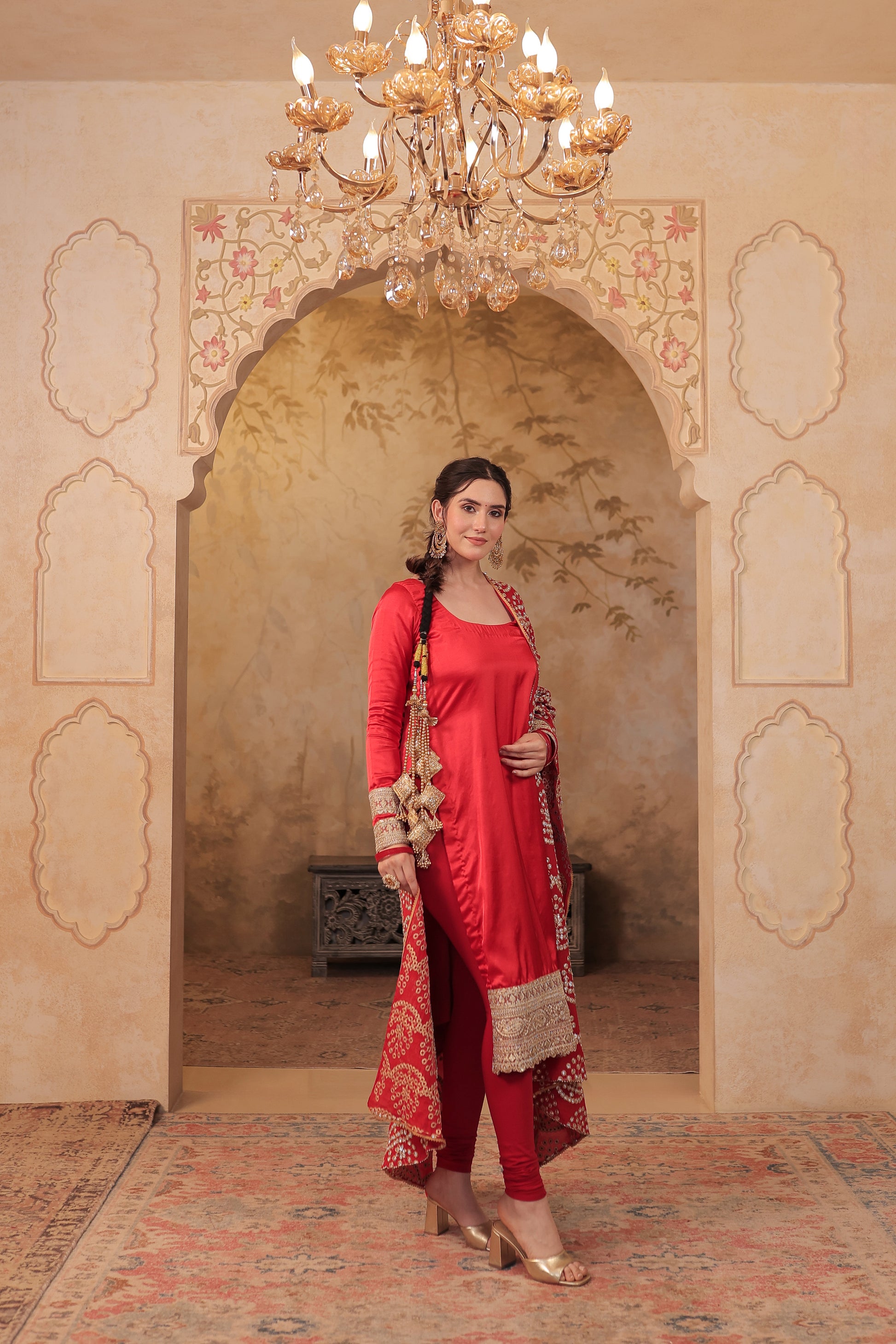 Red Rani Silk suit by Imagine By Shiwali featuring intricate silk fabric and traditional design.