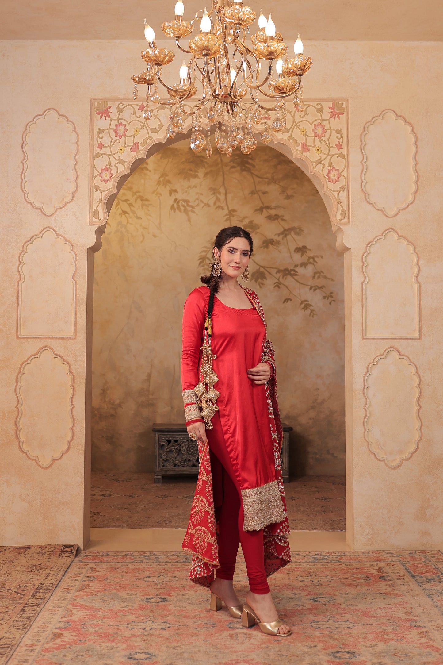 Red Rani Silk suit by Imagine By Shiwali featuring intricate embroidery and traditional design with matching dupatta.