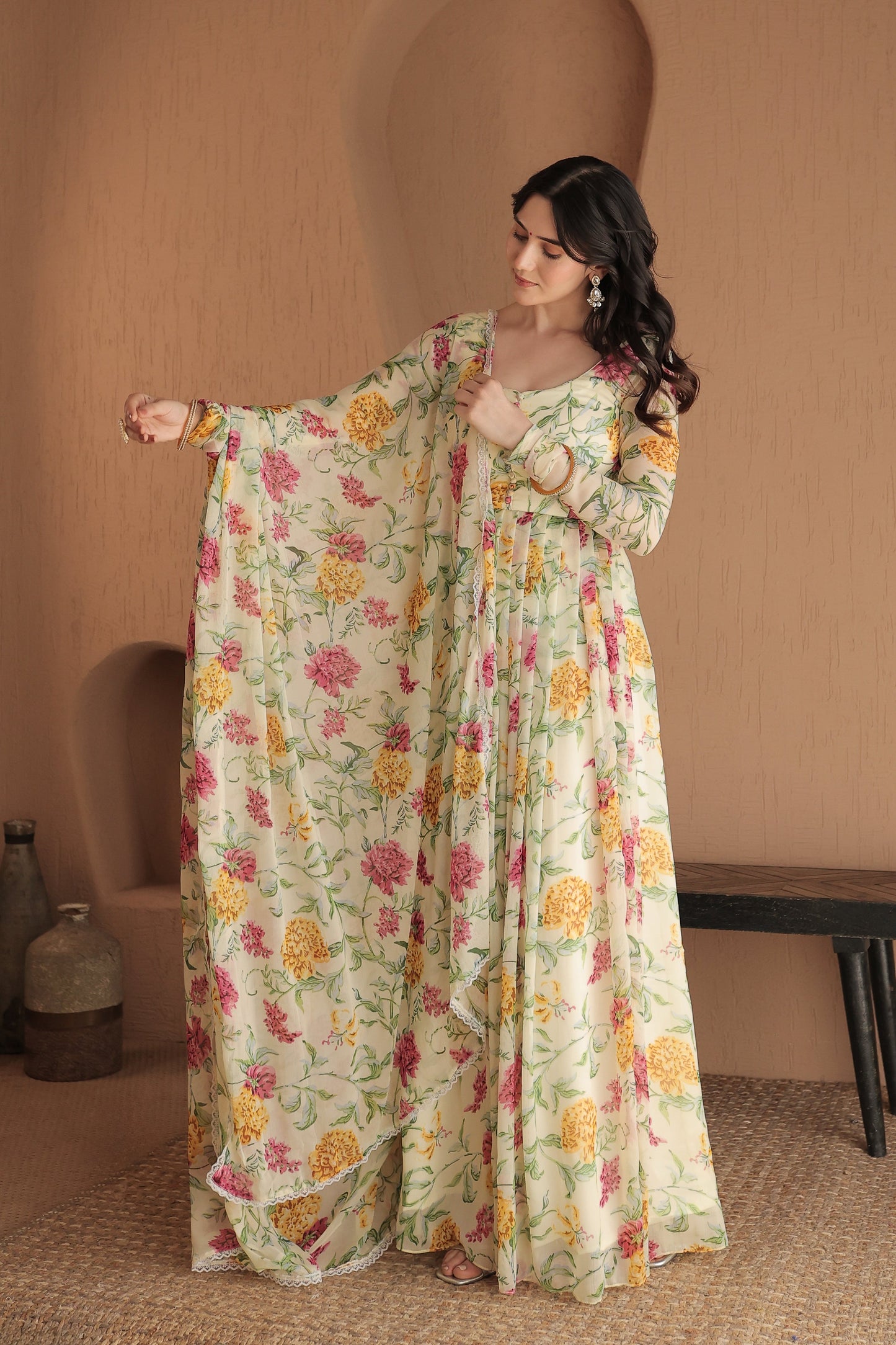 Beige floral Rasiya Anarkali dress by Imagine By Shiwali featuring intricate embroidery and flowing fabric.