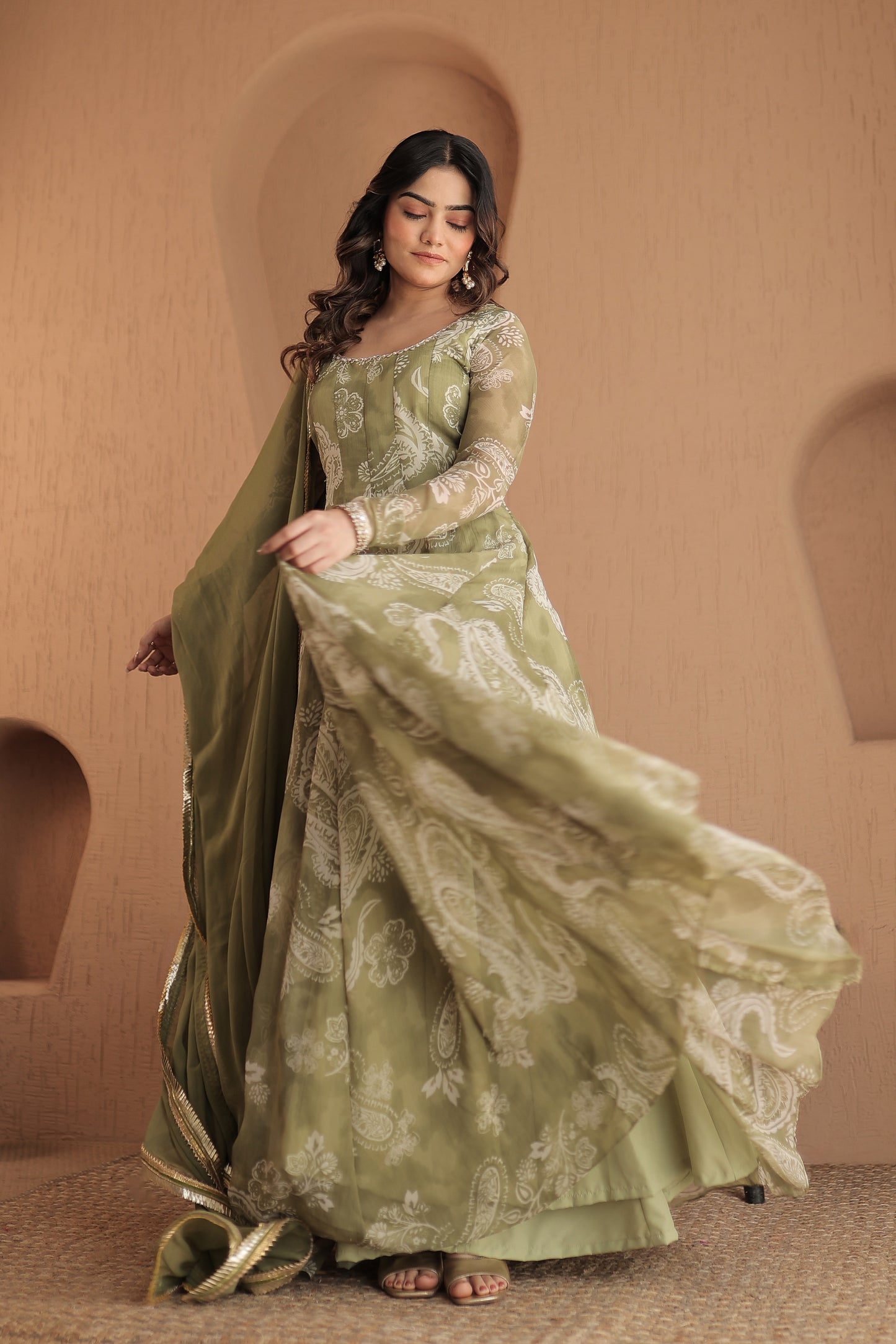 Green chiffon Rasiya anarkali dress by Imagine By Shiwali with intricate embroidery and flowing silhouette.